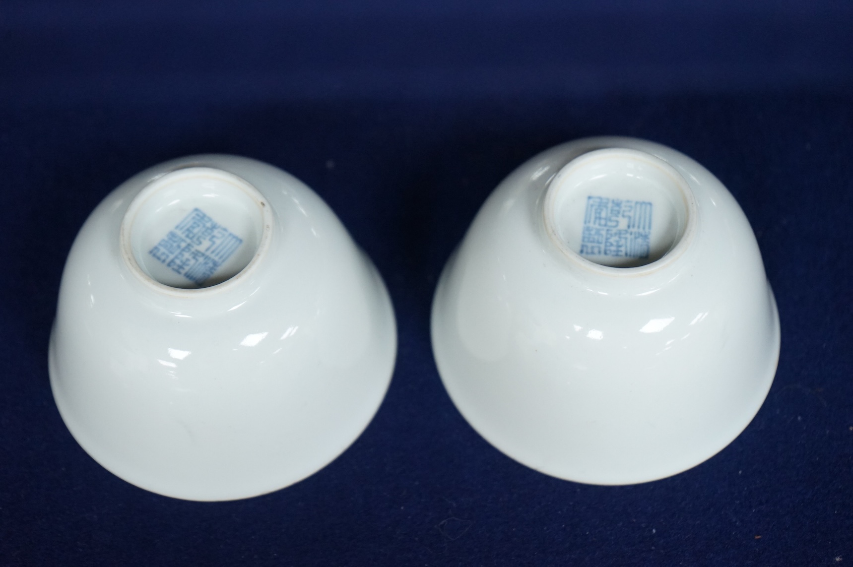 A pair of Chinese white glazed porcelain tea bowls, 6cm high